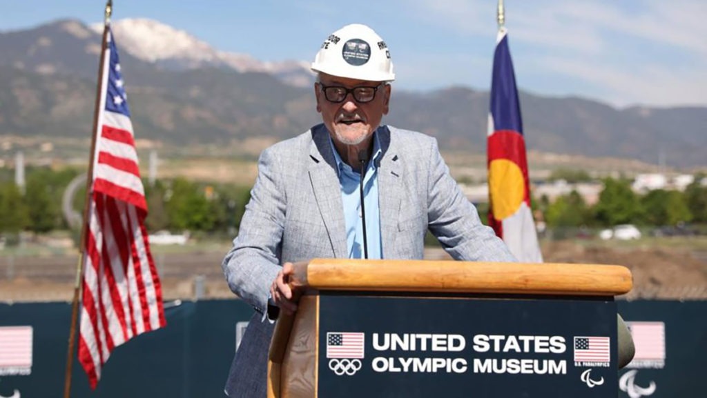 Dick Celeste stands at the podium, wearing a hard hat, and speaks before the official groundbreaking for the Museum