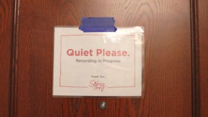 Sign on door says "Quiet Please"