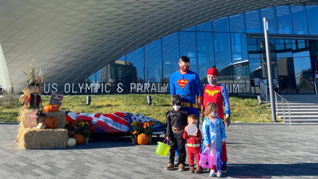 A family in costume poses outside the Museum.