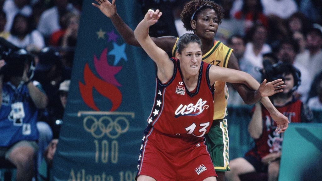 Rebecca Lobo posts up against a defender and waits to receive the ball