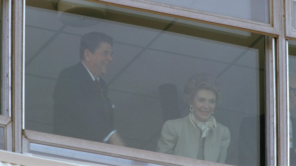 Ronald Reagan and his wife Nancy watch from a box atop the stadium at the Los Angeles 1984 Opening Ceremony