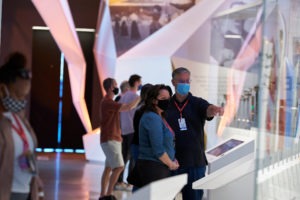 Man and woman enjoy photo exhibit at USOPMuseum.
