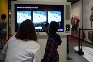 Mother and child interact with exhibit at USOPMuseum.