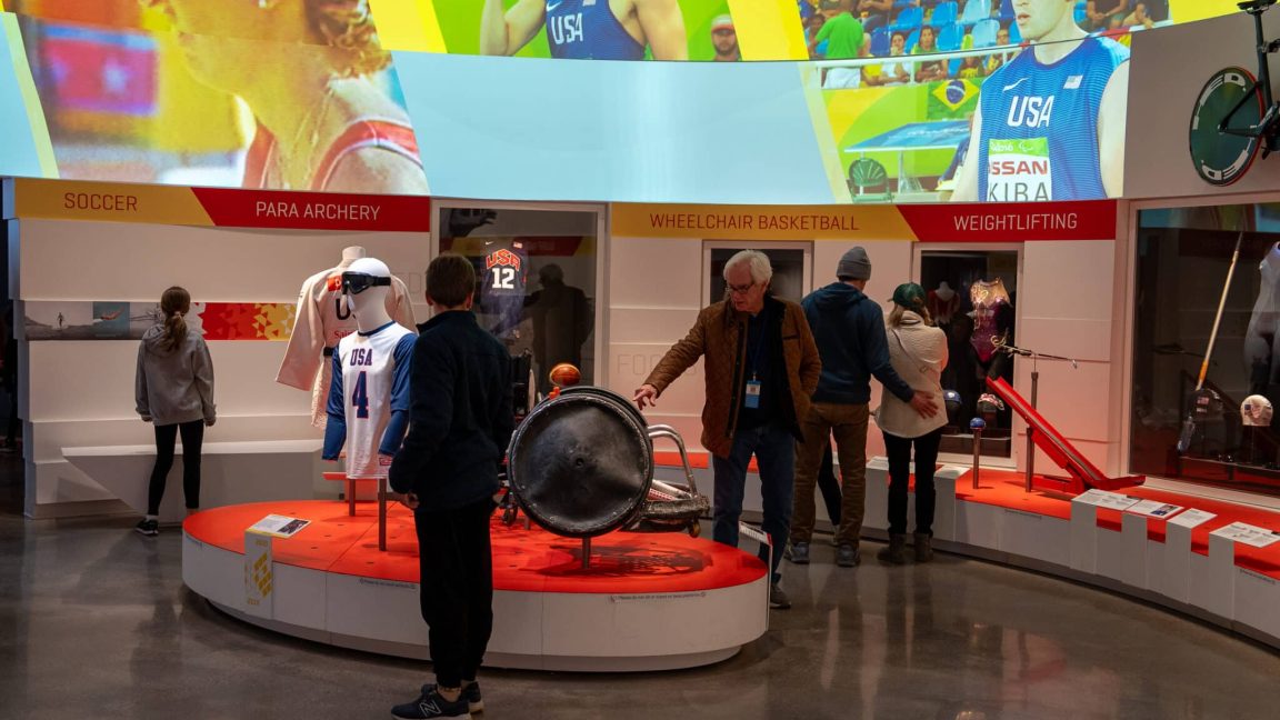 Guests admiring the Summer Games artifacts