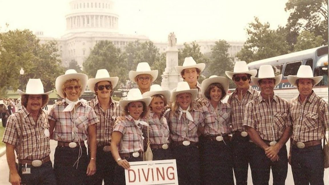 Members of the 1980 U.S. Olympic Diving Team, wearing plaid shirts, jeans and cowboy hats, pose in front of the U.S. Capitol during a visit to Washington