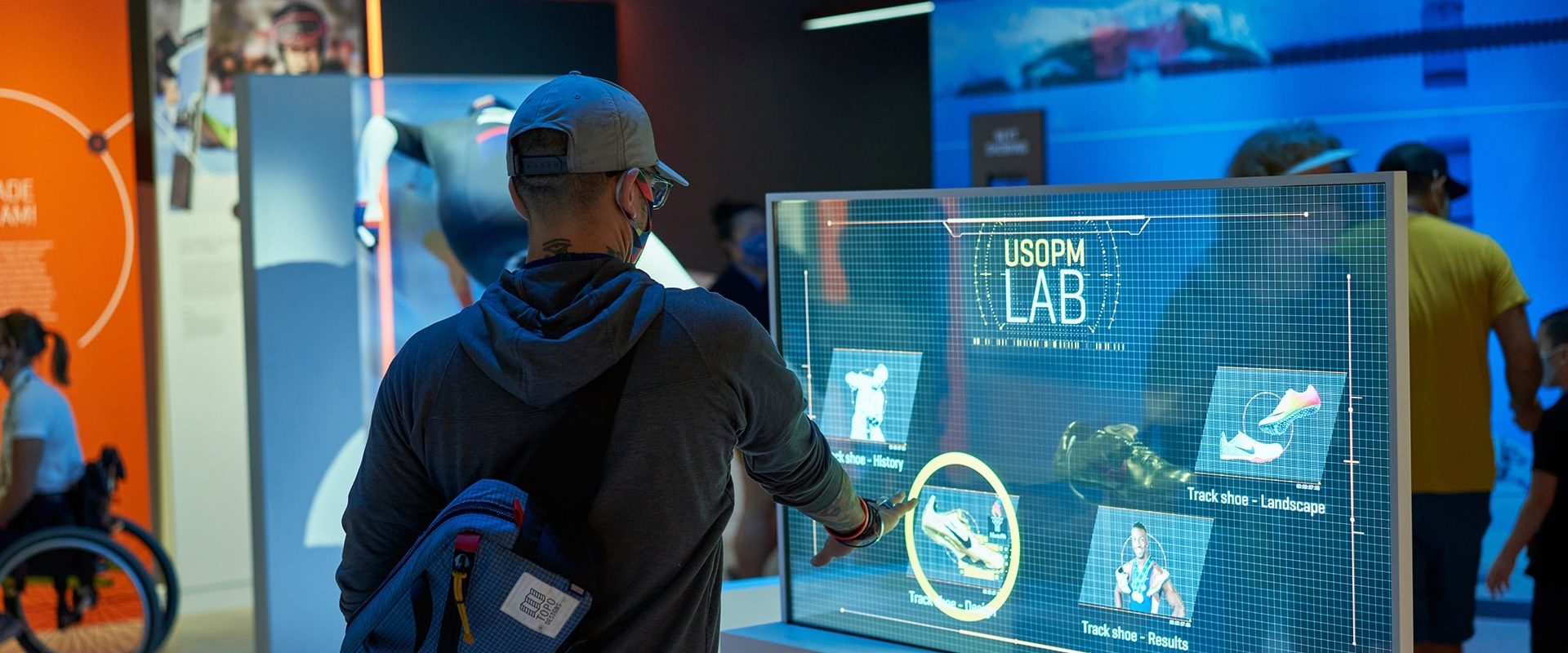 A guest interacts with an exhibit in The Lab